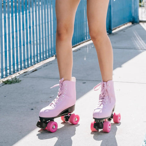 Person wearing pink roller skates outdoors on concrete with Rugged Rubber Roller Skate Stopper Brake Block With Bolt Holes Adjustable Toe Stop