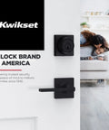 Casey Dummy Door Handle For Closets And Pantry, Single Sided Lever For French Doors in matte black on a white door with Kwikset logo