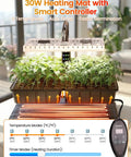 Full Spectrum LED Grow Light Seed Starter Kit with Heating Mat and Adjustable Dome shown with young seedlings indoors.