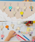 Color Your Own Hot Air Balloon Keychains Kit With 24 Wooden Blanks, 12 Styles, DIY Craft Set For Kids And Adults on display and in use