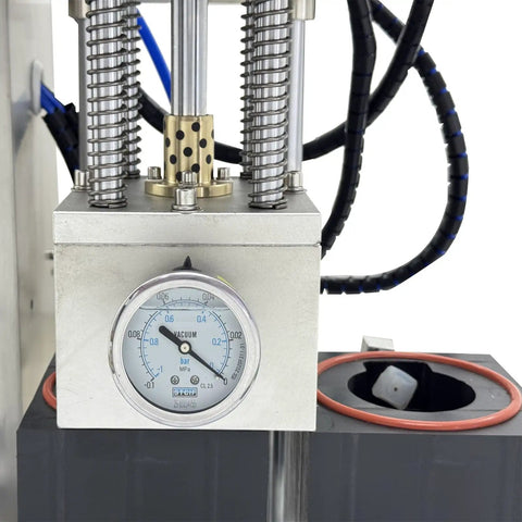 Close-up of the dual head automatic vacuum capping machine pressure gauge, showcasing precision engineering and vacuum settings.