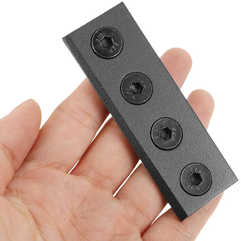 Close-up of a Heavy Duty Sliding Barn Door Hardware Connector Track Bracket in black finish, held in hand for size reference.
