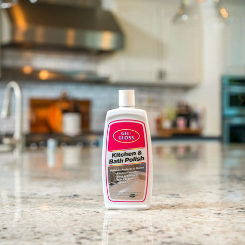 Real Deal Carnauba Wax Kitchen And Bath Polish Removes Scratches Stains Water Spots Protects Fiberglass Marble Acrylic Ceramic Chrome Stainless Steel 16 Oz Jar displayed on a clean kitchen countertop.