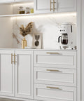 25 Pack Champagne Bronze Cabinet Pulls 3 Inch Drawer Handles installed on modern white kitchen cabinets with brushed stainless steel finish