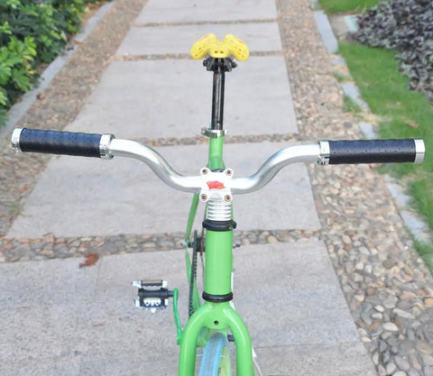 Grippy Leather Double Lock On Bike Grips 22.2mm For Mountain And Road Bikes mounted on a green bike with curved handlebars