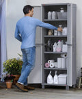 Man organizing shelves of Built Tough Resin Storage Cabinet With Lockable Doors And Five Shelves 55 Lb Per Shelf Capacity Tall 72 Inch Unit For Laundry Room Garage Bathroom And Closet White And Grey.