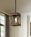 Awesome Oak Wood And Matte Black Farmhouse Pendant Light With 59 Inch Adjustable Chain And Killer Style Easy Hang Single Cage Fixture hanging in a home interior.