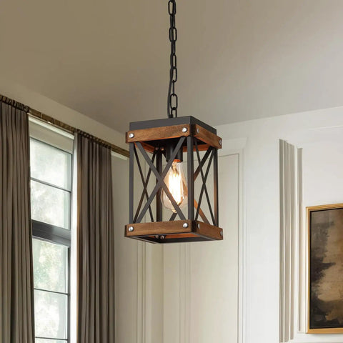 Awesome Oak Wood And Matte Black Farmhouse Pendant Light With 59 Inch Adjustable Chain And Killer Style Easy Hang Single Cage Fixture hanging in a home interior.
