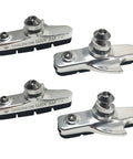 Four Piece Premium Bike Brake Pads For Mountain Bikes With V Brake Compatibility Durable Synthetic Fiber And Nitrile Rubber Pads Long Lasting Brake Blocks Kit In Silver Finish featuring a set of four silver brake pads.