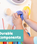 Toddler using Zebra Activity Wall Panel For Toddlers Ages 18 Months Plus Montessori Sensory Toy with nesting shape activity.