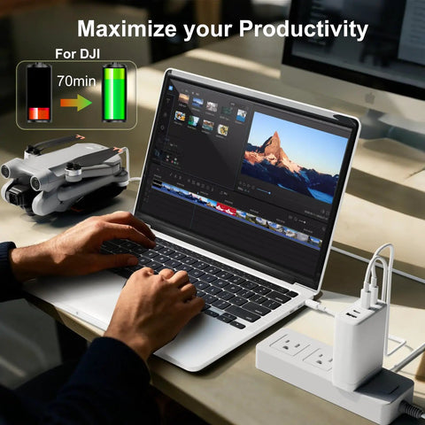 Person using laptop with GaN 100W USB C Fast Charger For DJI Drones, 4 Port PD Power Hub, drone and charger on desk.