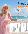Woman using Phone Camera Grip With Selfie Stick Tripod Magnetic Mount And Detachable Wireless Shutter Button on beach