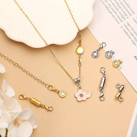 24 Pcs Magnetic Necklace Clasps Set In Round Cylindrical And Tubular Styles, Silver And Gold Finishes on a beige surface