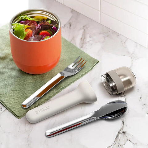 Pocket Utensil Set In Grey With 18/8 Stainless Steel Fork Knife And Spoon Nestled In A Compact Case For Travel, shown with salad bowl.