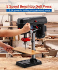 Ideally House 8 Inch Benchtop Drill Press With Powerful 2.5A Motor And Five Adjustable Speeds For Precise Wood And Metal Drilling Projects Featuring Tilting Table That Goes From Zero To Forty-Five Degrees For Angled Holes in a workshop setting.