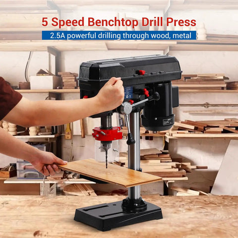 Ideally House 8 Inch Benchtop Drill Press With Powerful 2.5A Motor And Five Adjustable Speeds For Precise Wood And Metal Drilling Projects Featuring Tilting Table That Goes From Zero To Forty-Five Degrees For Angled Holes in a workshop setting.