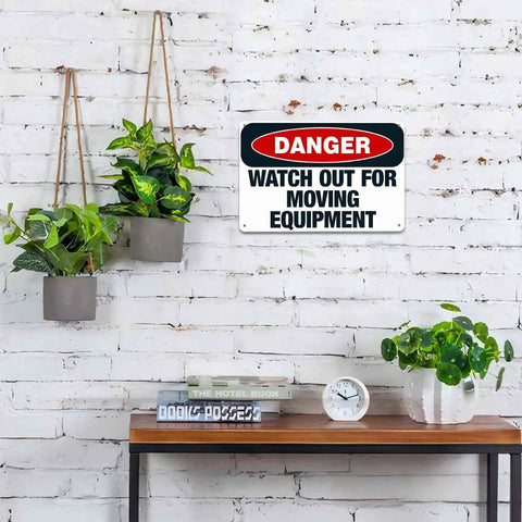 Heads Up Watch Out For Moving Equipment Aluminum Sign 8x12 Inch on brick wall above table with plants and clock