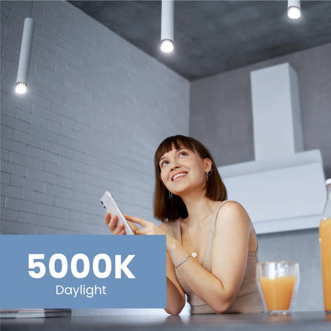 Woman enjoying bright light from 6-Pack MR16 LED Bulbs 50W Equivalent Dimmable 5000K Daylight in kitchen setting