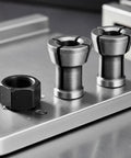 M17 Collet Nut Set With Dead On Chuck Grip Lock Down Tool Holder Mounting Hardware showing black hex nut and two collet nuts on metal surface.