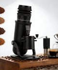 Heavy Duty Aluminum Single Dose Coffee Grinder With 48Mm Seven Star Conical Burr and Sixty Micro Adjustment Settings for Top Shelf flavor extraction on wooden counter.
