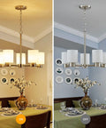 Five Light Bathroom Vanity Light Fixture Over Mirror In Brushed Nickel with E26 base shown on and off above dining table.