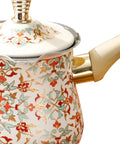 Ornate Turkish coffee pot with floral pattern and beige handle, top view with lid.