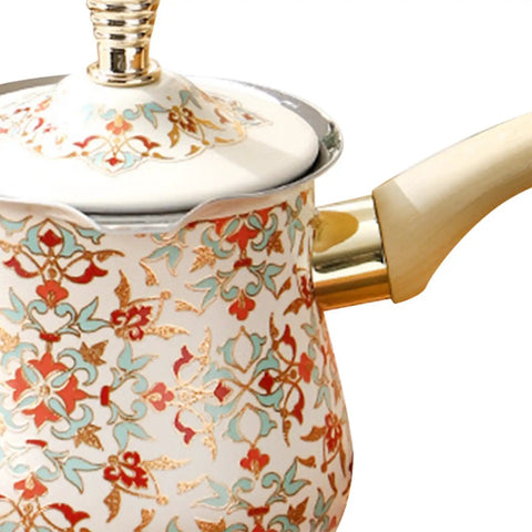 Side view of decorative Turkish coffee pot with floral pattern, part of a 500ml Turkish Coffee Pot Stovetop Espresso Maker With Long Wooden Handle Stainless Steel Brew Kettle For Turkish Coffee Or Heating Milk On The Stovetop Notch Quality Easy Grip Durable Kitchen Essential.