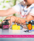 Child assembling RC car with SG90 9g micro servo motor from 16 Pack Mini SG90 9g Micro Servo Motors RC Servo Kit For Robots, Helicopters, Planes, Cars, Boats, Complete Set With Arms, Fixing Screws And Easy Mounts