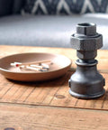Built Tough Malleable Iron Reducing Coupling Threaded Pipe Fitting Connector 6X4 Inch displayed as a decorative piece.