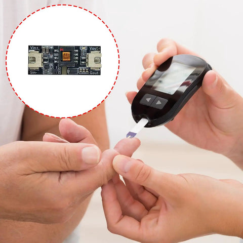 High Efficiency DC DC Boost Converter Module With Isolated PCB Board For Electronics Prototyping, showcased with a diabetes meter.