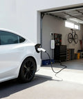 Top Tier Level Two EV Charger 16 Amp 240 Volt 3.2 KW EVSE charging a white electric vehicle in a garage with tools.