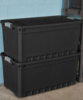 Heavy Duty Workhorse Plastic Storage Totes 50 Gallon Bulk Nine Pack Featuring Secure Snap Latching Lids Stackable Bin Set stacked against a blue wall.