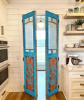 Blue Hand Carved Custom Built Door For Interior Or Exterior Use Antique Barn Style Sliding Or Hinged Door Front Or Pantry Door Sized 71x34 Inches Glass And Hardware Not Included shown installed in a kitchen area.