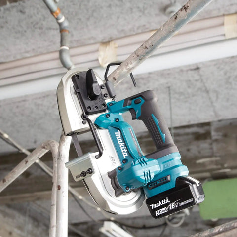Compact 18V Cordless Brushless Portable Band Saw Featuring No Fuss Blade Setup Variable Speed Throttle And Rugged Aluminum Guide Rail in use on metal pipes.