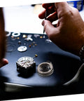 Hands repairing clock using Complete Mechanical Alarm Clock Repair Kit With Spring Steel Return Spring Assembly And Parts For Vintage And Modern Clocks DIY Watch Repair Tools And Accessories For Easy Maintenance And Rebuilds.