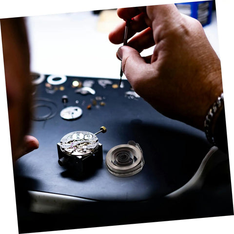 Hands repairing clock using Complete Mechanical Alarm Clock Repair Kit With Spring Steel Return Spring Assembly And Parts For Vintage And Modern Clocks DIY Watch Repair Tools And Accessories For Easy Maintenance And Rebuilds.