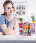 Happy person enjoying a drink beside a 360 Rotating Drink Packet Organizer Acrylic Lazy Susan with beverage mixes.