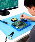 Fabater anti-static ESD mat on blue work surface with PCB board and grounding wire
