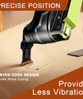 Curved-edge oscillating tool blade on a multitool, black blade with orange edge label for wood cutting