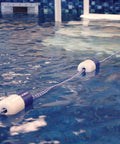 Premium Chrome Brass Pool Safety Rope Hooks With Set Screws For 3/4 Inch Divider Line and Float Kit in water, showcasing mounted safety line.