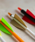 Closeup of High Profile 2.25 Inch Orange Arrow Vanes 36 Pack for Stable Flight Archery Fletching Vanes on arrows