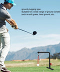 Golfer using Golf Swing Trainer For Home Practice Easy Install Groover And Training Aid on grass with mountains in background.
