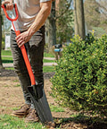 Person using All Steel Drain Spade With D-Grip Handle, Heavy Duty 12-Gauge Welded Blade for trench work in garden