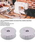 Top Shelf Aluminum Industrial Sewing Machine Bobbins 32 Mm Cnc Machined Dead On Balanced Winding Twin Pack on wooden table.