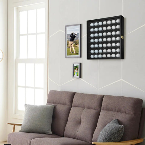 Living room with Golf Ball Display Case For 49 Balls Wall Mount Shadow Box with locks above a brown couch