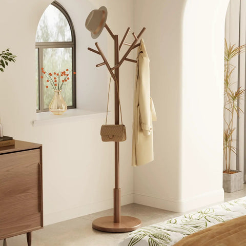Solid Wood Coat Rack Freestanding Tree With 12 Hooks And 3 Height Levels Adjustable Coat Stand For Entryway Or Bedroom A Real Game Changer For Coats Hats Bags And Scarves Walnut Finish showing in a bedroom corner with items hanging