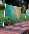 Rowing Team Handheld Flags On Sticks Ocean Sea Landscape Mini Flags For Parades Parties Team Activities And Holiday Decor Great For School Events Boat Races And Game Day Team Spirit 10 Pack on grassy patch next to bricks
