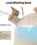 Close-up of Stove Top 2.5 Quart Whistling Tea Kettle With Food Grade 18 8 Stainless Steel Wood Pattern Folding Handle Creamy White Finish Fast Heating Easy Clean Includes Silicone Heat Insulation Pad showing water line and tip for kettle use.