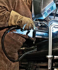 Welder using Beefy Heavy Duty F Clamp With 12 Inch Opening And Five And A Half Inch Throat Delivers 2660 Lbs Clamping Force For Tough Jobs