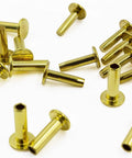 Brass Knife Handle Rivets 25 Piece Set for Knife Making High Strength 5/16 by 1/2 Inch Pins scattered on white background